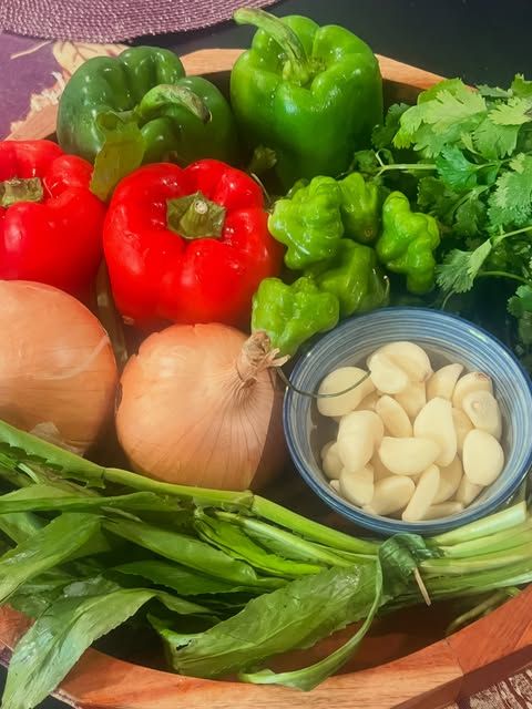 Sofrito ingredients: peppers, onions, garlic, and herbs